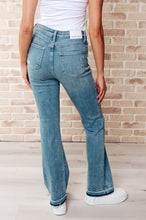 Load image into Gallery viewer, Isla Mid Rise Distressed Released Hem Bootcut Jeans